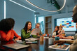 © VICTOR TORRES/Stocksy - Diverse team working on a project in a modern office setting
