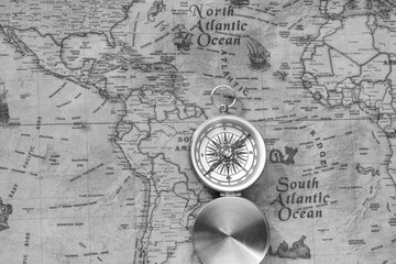  Classic round compass on background of old vintage map of world