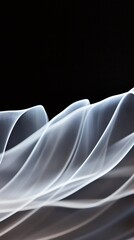 Poster - White waves creating an abstract pattern on a black background