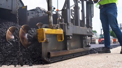 Fototapete - Close-up shot focusing on detailed process of asphalt paving, showcasing smooth layer application and paving machinery