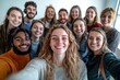 © whitestorm - A fun scene of a diverse group of colleagues taking a humorous selfie during a virtual meeting, with genuine smiles and a softly blurred office backdrop