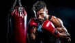 © mestock - Muscular boxer wearing red gloves punching heavy bag with intense focus, demonstrating athletic power and fighting technique in dimly lit training environment