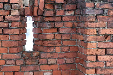 Poster - A worn-out brick wall with a gap, perfect for various uses such as architecture, urban design, or conceptual ideas.