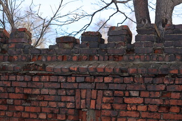 Poster - A damaged brick wall with a hole in it.