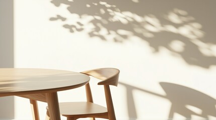 Poster - soft shadows dance on the wall beside a wooden table and chair during a sunny afternoon