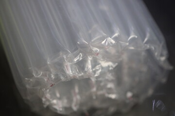 Poster - A group of plastic bags caught in a tight bundle.