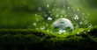 © Dee karen - Crystal ball on moss with icons in green forest - environment esg concept, ecology and sustainable environment of the world. Eco-friendly green business. ecology, earth day, csr and net zero