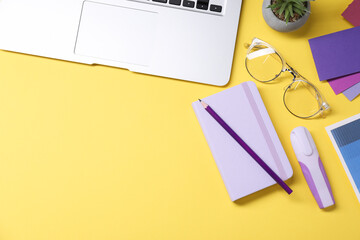 Aufkleber - Designer's workplace. Flat lay composition with stationery and laptop on yellow background, space for text
