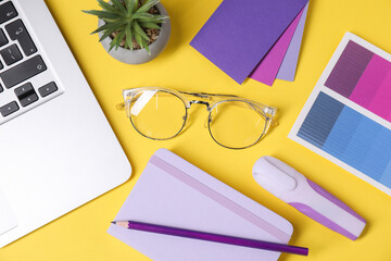 Aufkleber - Designer's workplace. Flat lay composition with stationery and laptop on yellow background