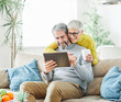 © Lumos sp - woman couple senior man happy internet love tablet together mature active elderly retirement computer technology online using caucasian home adult family romance