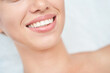 © elenavolf - Close up of smiling caucasian female with perfect teeth and smooth skin.