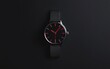 © creatfive - Black Wristwatch with Red Hands on Dark Background