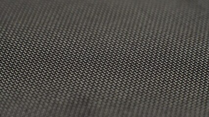 Metal wire mesh rotating in circle. Abstract background texture macro