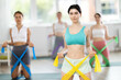 © JackF - Group of young women with working out with rubber bands on my knees in gym