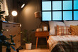 © Pixel-Shot - Big comfortable bed and bedside table in interior of bedroom at night