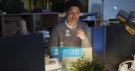 Poster - Working late in office, man using laptop with animation on screen
