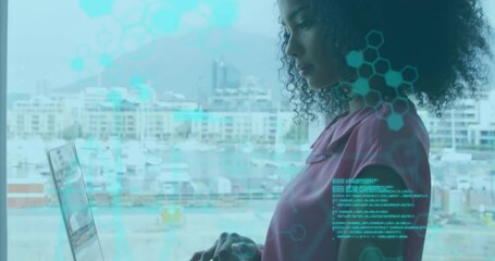 Poster - woman using laptop by window with digital network animation overlay