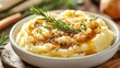 © Josiah - Delicious close-up of creamy mashed potatoes with gravy and herbs for a festive Thanksgiving dinner