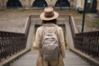 © Emanuel - woman with backpack going down a staircase