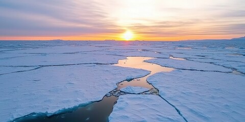 Poster - A breathtaking sunset illuminates the icy landscape, with cracks in the ice revealing tranquil waters underneath.