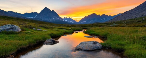 Poster - A stunning sunset over mountains, reflecting in a serene river surrounded by lush greenery and rocky formations.