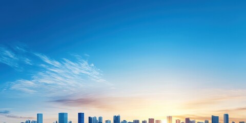 Poster - A stunning skyline at sunset, showcasing modern buildings against a vibrant blue sky with wispy clouds.