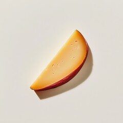 Poster - Creamy wedge of gouda cheese placed on a light background showcasing its smooth texture and rich color