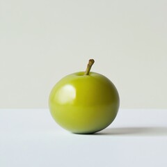 Poster - Fresh glossy green olive resting on a smooth surface with neutral background for a simple yet elegant look
