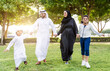 © oneinchpunch - Happy family spending time together outdoor in Dubai