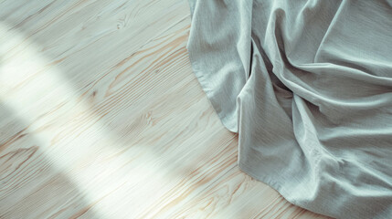 Poster - Realistic gray handmade tablecloth on light wooden surface