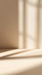 Poster - A serene interior scene showcasing soft shadows cast by window frames on a minimalist beige wall and floor, creating a calm atmosphere ideal for relaxation