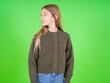 © Jihan - Close up side profile photo beautiful caucasian girl wearing green sweater not smiling attentive listen concentrated