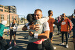 © Jacob Lund - Runners embracing after completing a successful race event