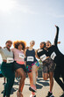 © Jacob Lund - Group of happy friends participating in a fun run event