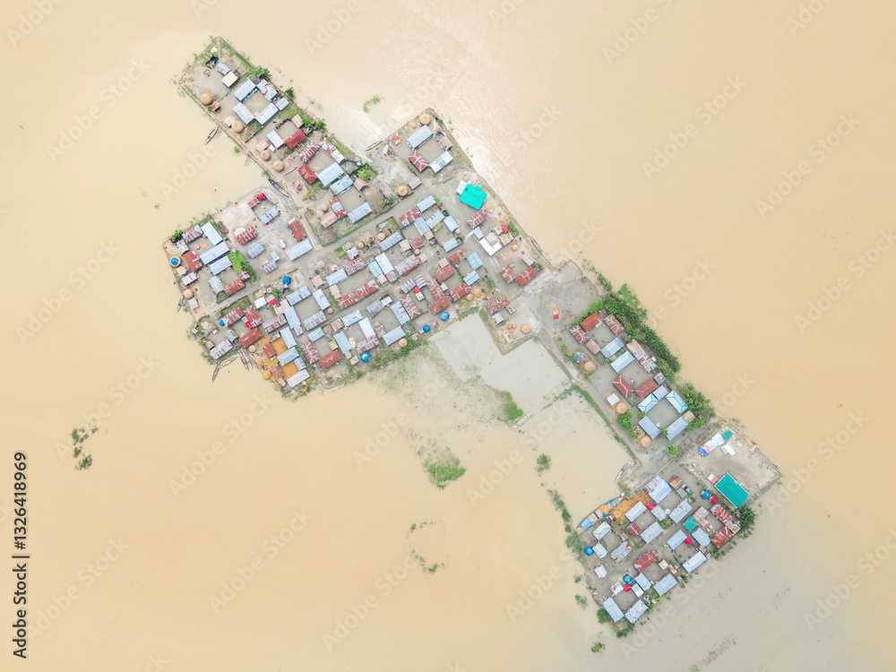 Aerial view of a devastated and submerged village with floating homes ...