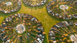 © AmazingAerialAgency - Aerial view of circular housing and gardens in a planned community with geometric patterns, Harekaer, Hovedstaden, Denmark.