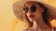 © Studicon - A woman wearing a straw hat and sunglasses