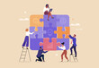 © nadzeya26 - Business Teamwork concept. Contemporary flat style abstract vector illustration of a company of diverse people putting together a huge puzzle details. Isolated on background