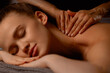 © Parilov - Hands of a massage therapist for young caucasian woman in tranquil spa environment
