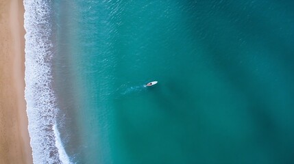 Poster - Aerial view of serene beach with lone surfer riding smooth waves in tranquil turquoise water : Generative AI
