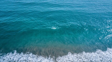 Poster - Aerial view of clear ocean waves gently rolling on a sunny beach shoreline : Generative AI