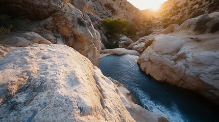 Poster - Sunset Over Rocky Canyon With Glimmering Water Flowing Through the Ancient Landscape : Generative AI
