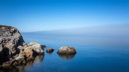 Poster - Serene Ocean View with Rocks and Clear Blue Skies Creating a Tranquil Coastal Landscape : Generative AI