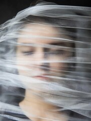 Poster - Expressive portrait of a woman partially obscured by sheer fabric creating dreamy effect : Generative AI