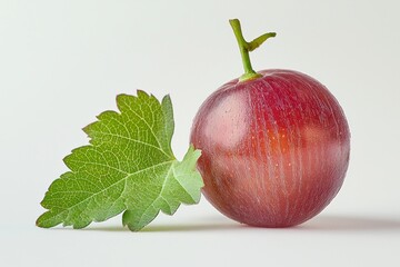 Poster - Radiant Red Globe Grape with Vibrant Green Leaf a Still Life Close Up on Neutral Surface