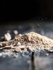 Poster - Fine ground powder with particles floating in the air on dark wooden surface : Generative AI