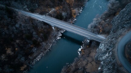 Aufkleber - Aerial view of a winding bridge crossing a serene river surrounded by autumn foliage showcasing stunning natural beauty : Generative AI