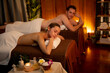 © InfiniteFlow - Caucasian couple customer enjoying relaxing anti-stress spa massage and pampering with beauty skin recreation leisure in warm candle lighting ambient salon spa at luxury resort or hotel. Quiescent