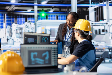 Poster - staff members in photovoltaics factory reviewing system logs to identify operational inefficiencies.