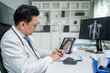 © Pavitra - Asian doctor providing telehealth video consultation to online patient.